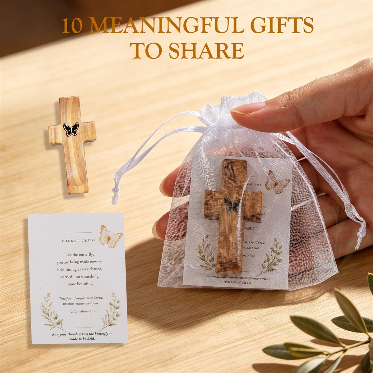 A pocket cross in a white organza bag with a blessing card, ready to give