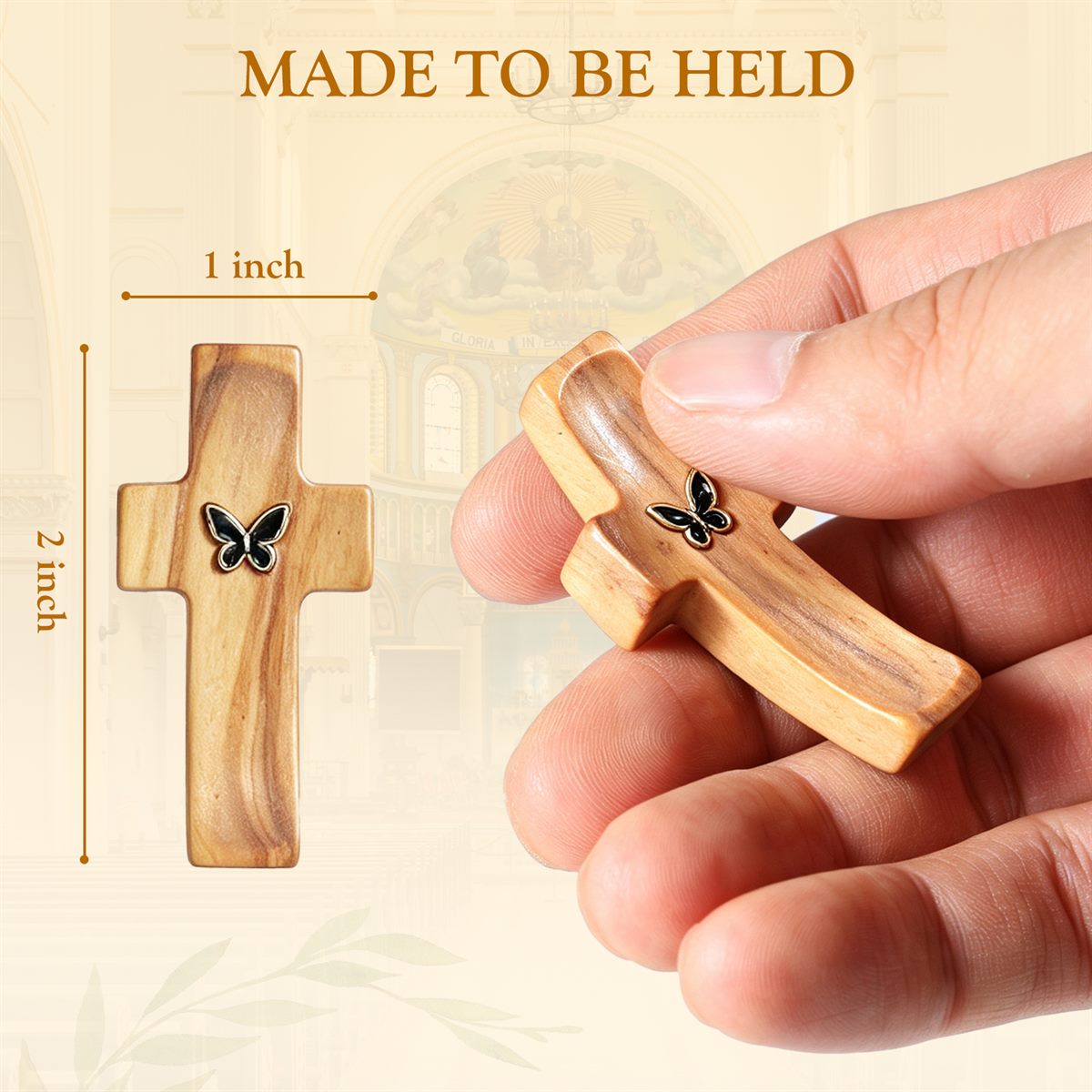 Wooden pocket cross measured about two inches tall and one inch wide, held in hand