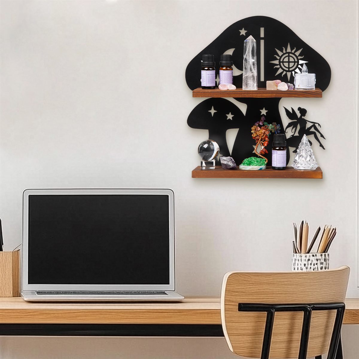 The mushroom shelf on the wall above a wooden desk with a laptop, in a home office